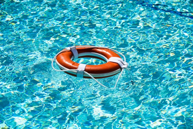 Lifebuoy on the water background the concept of help rescue drowning