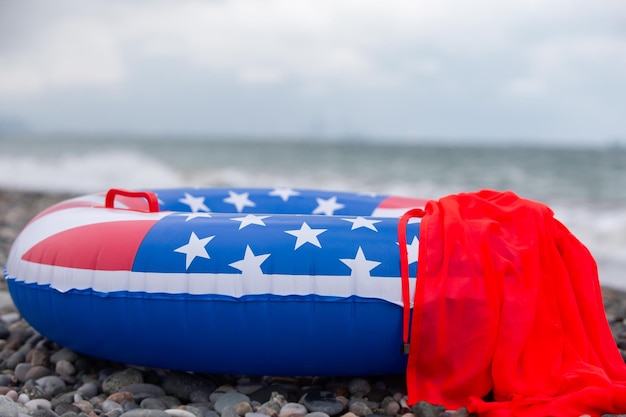 A lifebuoy with an American flag painted on the seashore Vacation vacation on American beaches