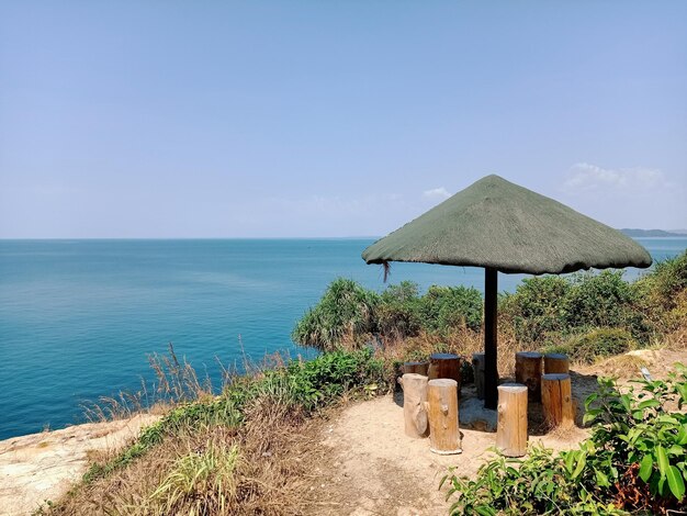 Lifeguard hut on beach against sky