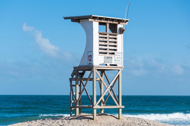 Lifeguard hut on beach against sky