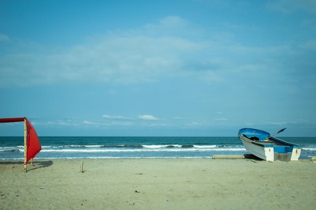 Lifeguard hut on beach against sky