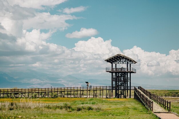 Lifeguard hut on field against sky