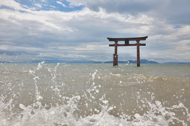 Lifeguard hut in sea against sky