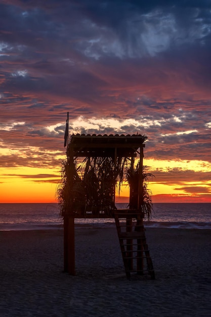 Lifeguard rest area on the beach during beautiful sunset