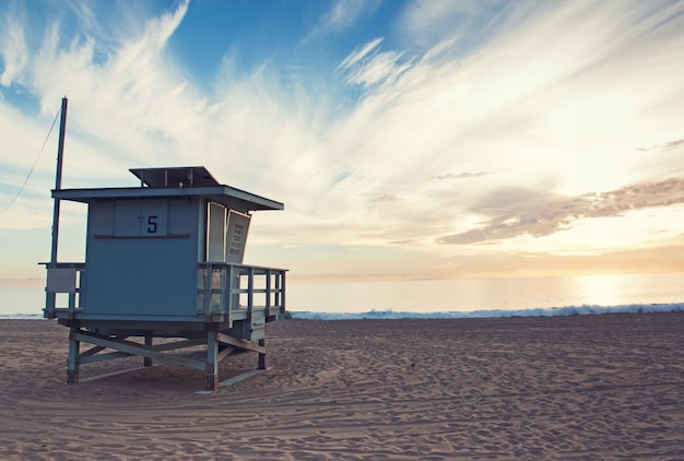 Lifeguard tower on sunset toned photo