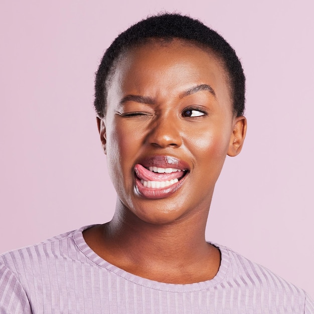 Lifes too short to not be weird Studio shot of a young woman making a silly face against a pink background