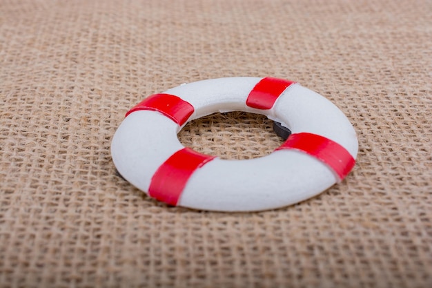 Photo lifesaver or life preserver on a fabric background