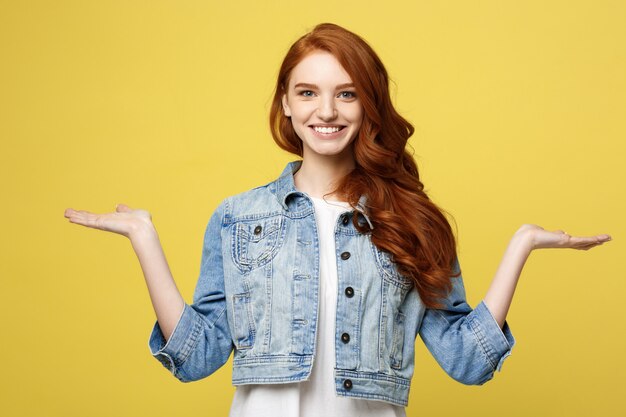 Lifestyle Concept: Surprised young woman with hand on side over golden yellow background