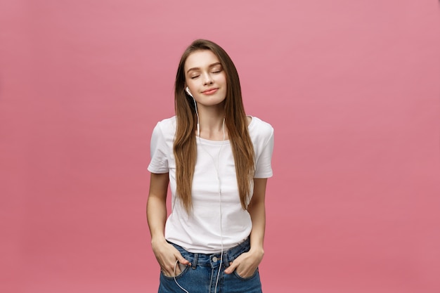 Lifestyle Concept. Young woman using phone for listening to music