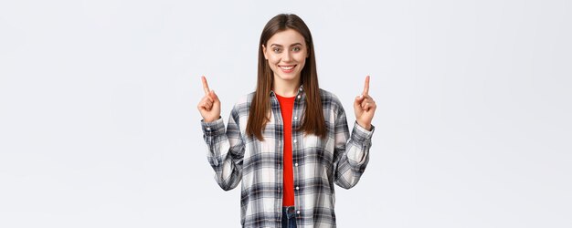 Lifestyle different emotions leisure activities concept confident smiling girl in checked shirt turn