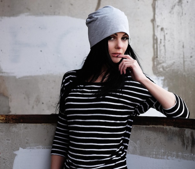 Lifestyle fashion and people concept beautiful woman wearing casual clothes and grey hat