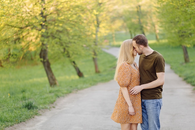 Lifestyle, happy couple playing on a sunny day in the park