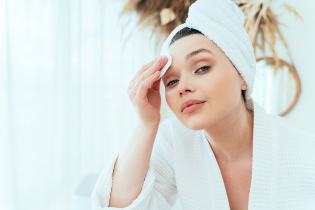 lifestyle moments of a young woman at home woman spending time in the bathroom