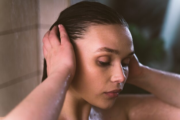 Lifestyle moments of a young woman at home Woman taking a shower in the morning