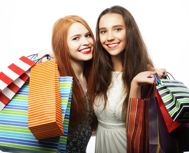 Lifestyle and people concept Portrait of two Beautiful young women with shopping bags