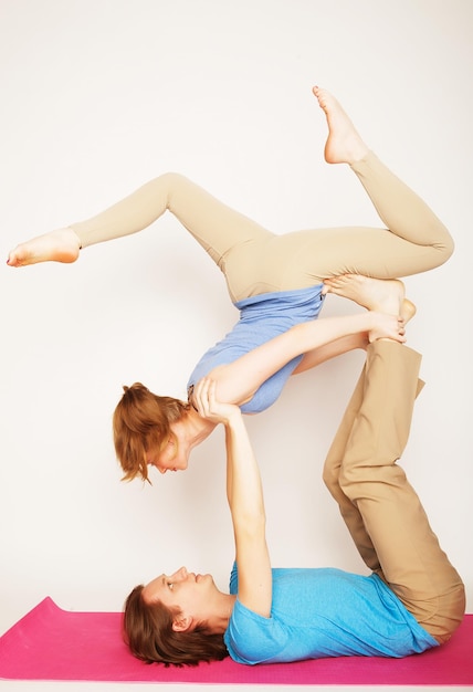 Lifestyle sport and people concept Young couple in yoga pose