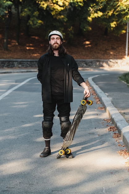 Lifestyle style of sketching, longboard. portrait of a bearded guy with a board. high quality photo