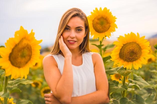 Lifestyle, a young caucasian blonde with sunflowers