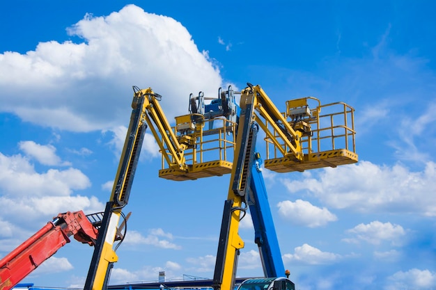 Lift buckets in the blue sky with clouds