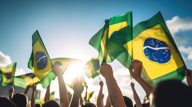 Lifting Brazilian Flags Back view group of People Holding Brazilian Flags