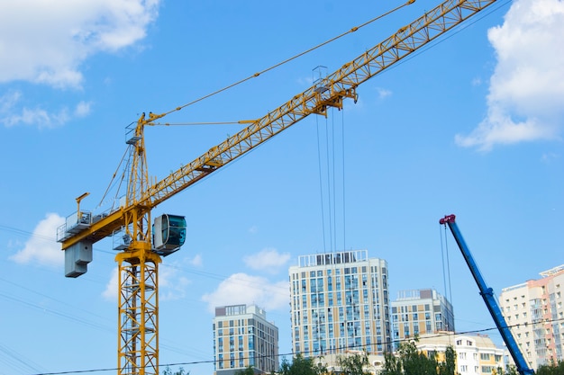 Lifting crane. Crane work on the construction site