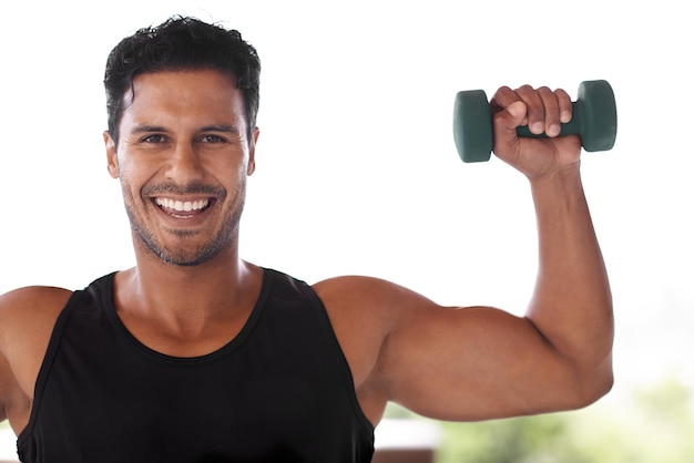 Lifting weights lifts his spirit Portrait of an enthusiastic man lifting dumbbells