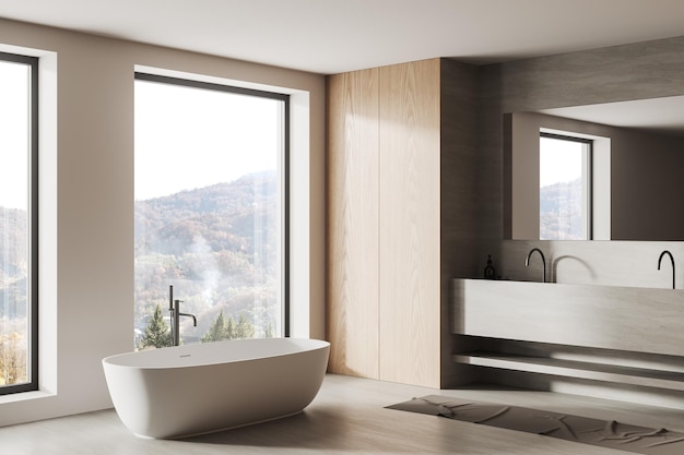 Light bathroom interior with sink and bathtub near panoramic window