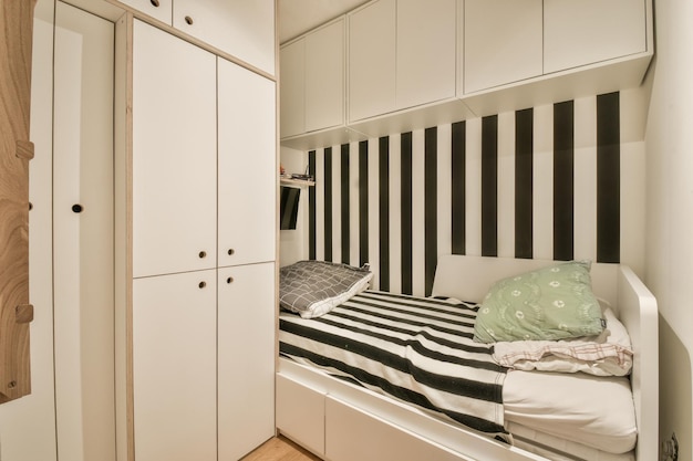 Light bedroom with white wardrobe