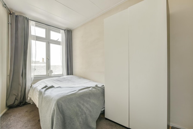 Light bedroom with wooden wardrobe