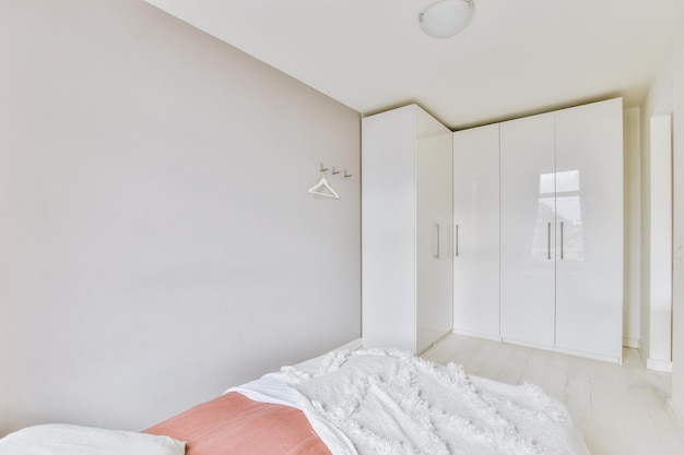 Light bedroom with wooden wardrobe