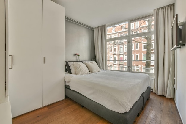 Light bedroom with wooden wardrobe