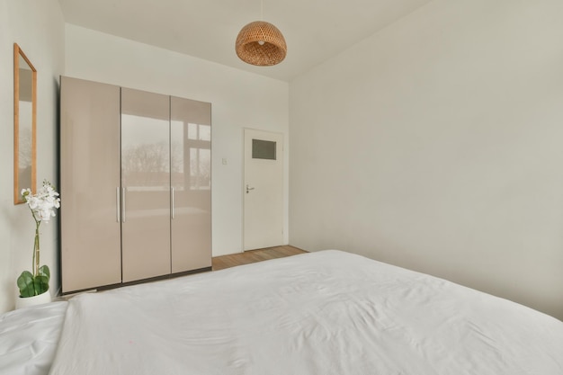 Light bedroom with wooden wardrobe