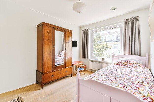 Light bedroom with wooden wardrobe