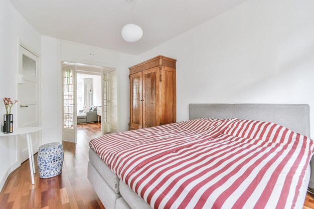 Light bedroom with wooden wardrobe