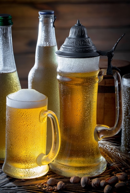 Light beer in a beer glass on an old background.