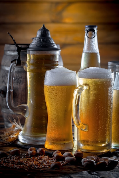 Light beer in a beer glass on an old background.