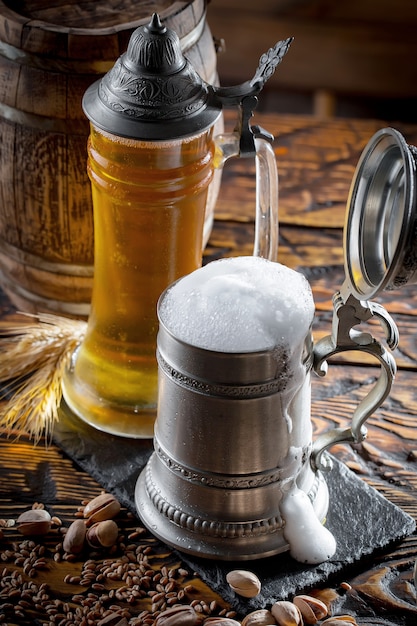 Light beer in a beer glass on an old background.