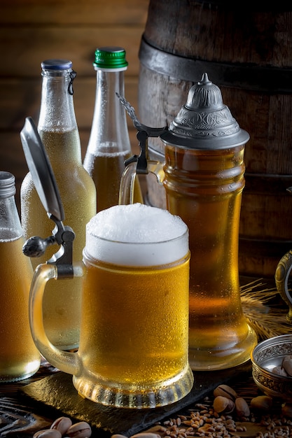 Light beer in a beer glass on an old background.