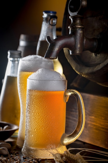 Light beer in a beer glass on an old background.