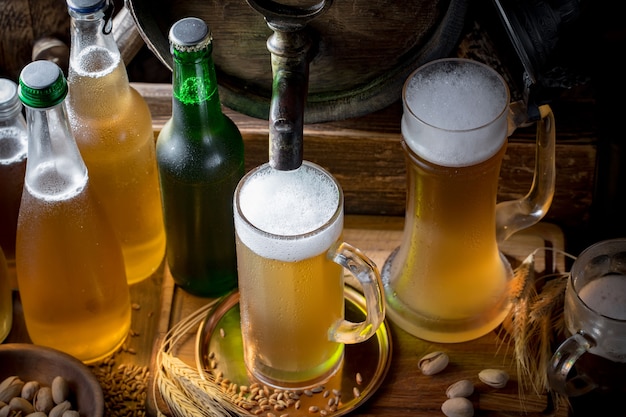 Light beer in a beer glass on an old background.