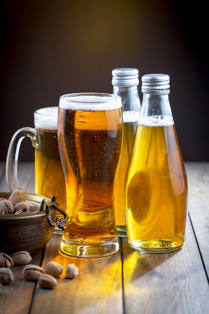 Light beer in a beer glass on an old background.