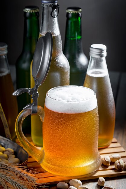 Light beer in a beer glass on an old background.