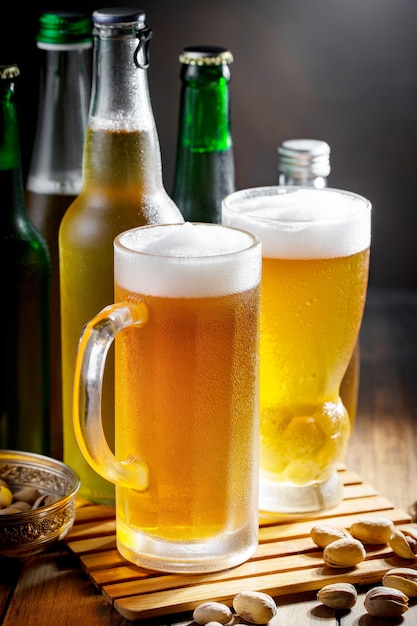 Light beer in a beer glass on an old background.