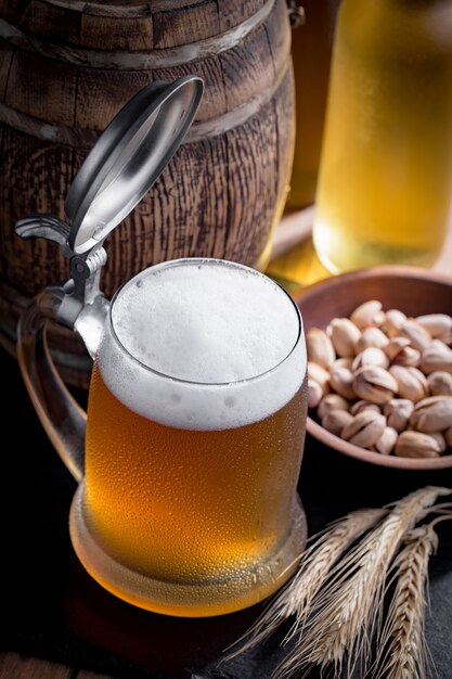 Light beer in a beer glass on an old background.