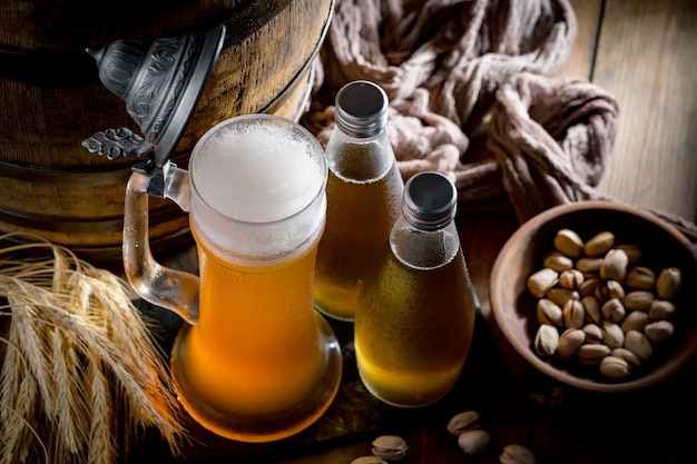 Photo light beer in a beer glass on an old background.