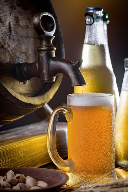 Light beer in a beer glass on an old background.