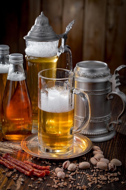 Light beer in a glass on an old background