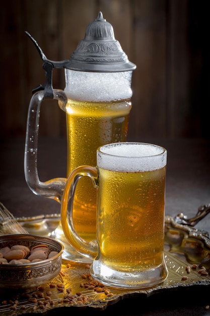 Light beer in a glass on an old background