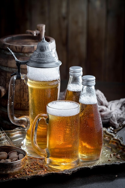 Light beer in a glass on an old background