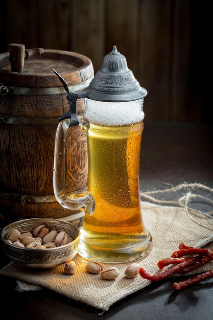 Light beer in a glass on an old background